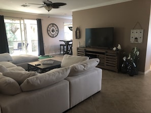 Open living area with entertainment center.