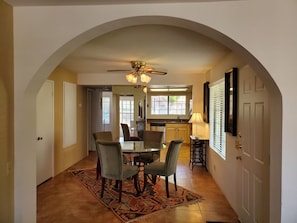 Through the living room arch towards the kitchen