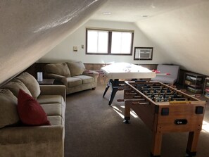 Loft with Bubble Hockey, Foosball, games and desk