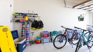 Garage stocked with tons of beach gear and bikes