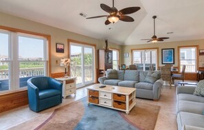 Top floor living area with deck facing road. Comfortable, with plenty of seating