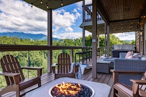 Lower level deck with fire pit, hot tub and outdoor games!