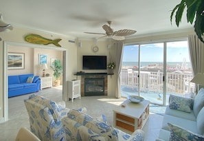 Comfortable living area with gas fireplace and flat screen TV with great views.