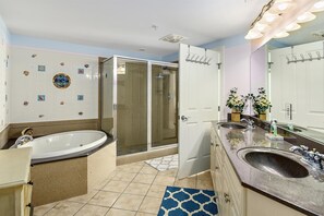 Master bathroom with walk-in shower and jetted tub