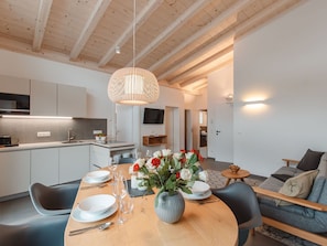 Table, Property, Furniture, Countertop, Cabinetry, Plant, Interior Design, Lighting, Wood, Living Room