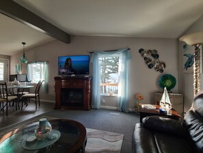 Morning sunshine lights up the kitchen and living room. Gorgeous lake views!