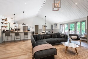Spacious living area with high ceilings—offering an airy, open feel perfect for comfort and style.