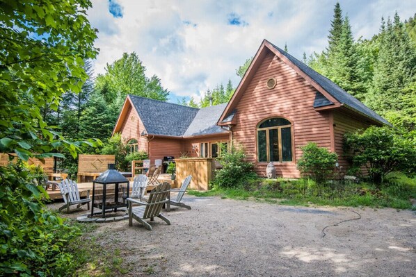 House surrounded by lush trees—perfect for a peaceful getaway and nature-filled escape.