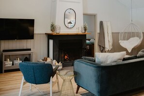 Cozy living area with a fireplace—ideal for relaxing and enjoying warm, inviting evenings.
