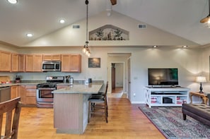 Living/dining rooms, 13' ceiling, large fan. It's open and airy yet super cozy.