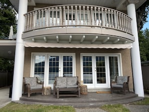 Upstairs: Master Balcony. 
Downstairs: Ground floor patio. 