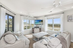 Living room with panoramic beach and pool views, Tidewater 101I, Isle of Palms, SC | IOP Escapes