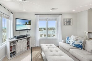 Living room with beach view and comfort seating, Tidewater 101I, Isle of Palms, SC | IOP Escapes