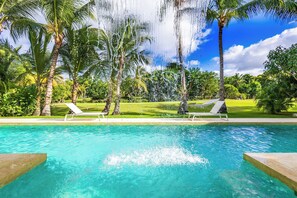 Comfortable loungers by the pool for sunny days.