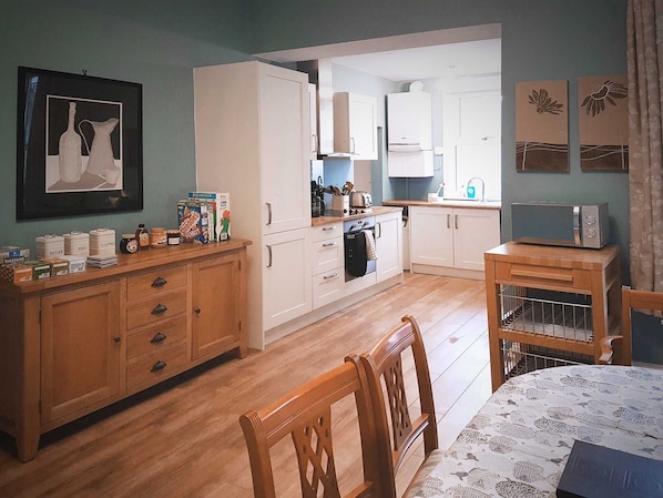 Well stocked spacious kitchen with dining area