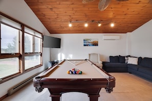 Second floor living room with pool table