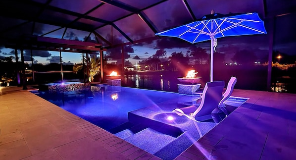 Pool, with fire bowls & ledge lounger furniture, with pool cooler & unbrellla