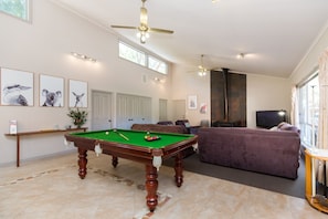 Parkview North's spacious living area with a pool table for leisure and lively moments.
