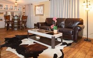 Great room combines living and dining areas with open concept kitchen. 55" smart tv with fast wifi.