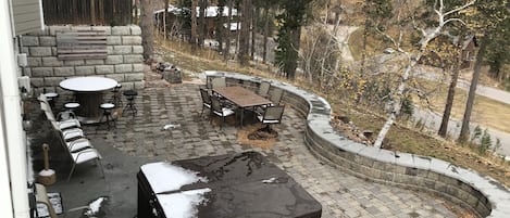 View from upper patio. Full lower level patio deck and hot tub