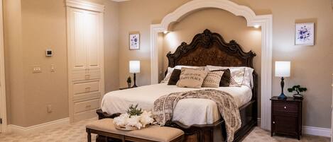 Master Suite features a king bed and comfy private seating area with fireplace.