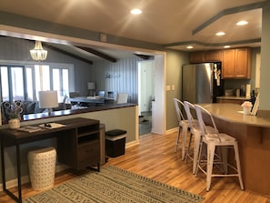 Kitchen with desk space, open to living room and dining room