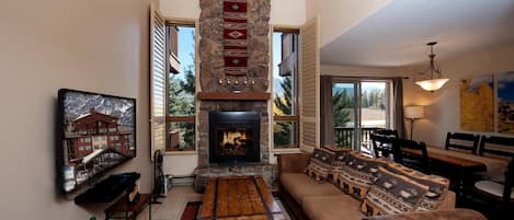 Living room with fireplace and TV