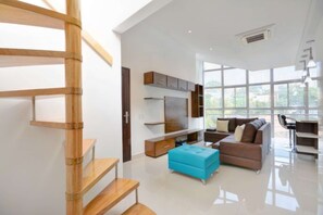 Living room and stairs to the 2nd floor