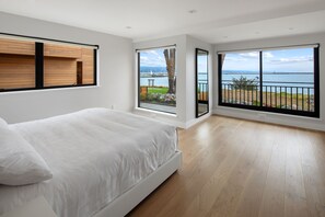 The master bedroom. Views of Mavericks lawn and the ocean. 