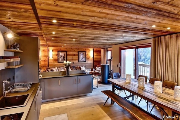 Kitchen/dining through to living area with balcony access