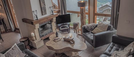 Lounge area with double height windows.