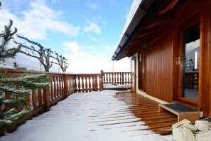 Side terrace area with views across the Tarentaise Valley towards La Plagne