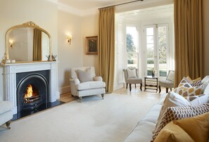 Ground floor: Sitting room with open fire and comfortable seating