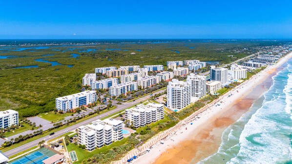 Aerial shot of compex, beach, and city