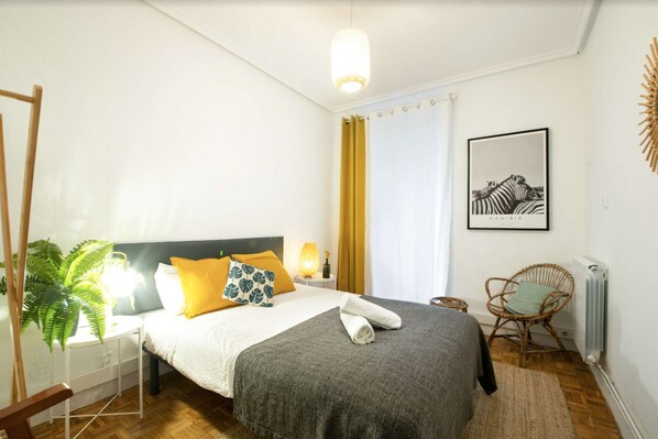 Bedroom with double bed and balcony
