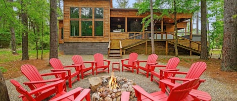 Enjoy the firepit at this modern luxury cabin.