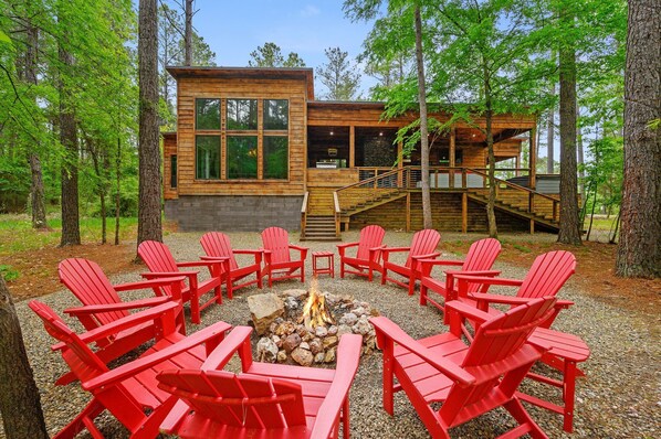 Enjoy the firepit at this modern luxury cabin.