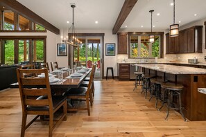 Larkspur Woods: - Large dining table for 8 with additional seating for 4 at the kitchen island.
