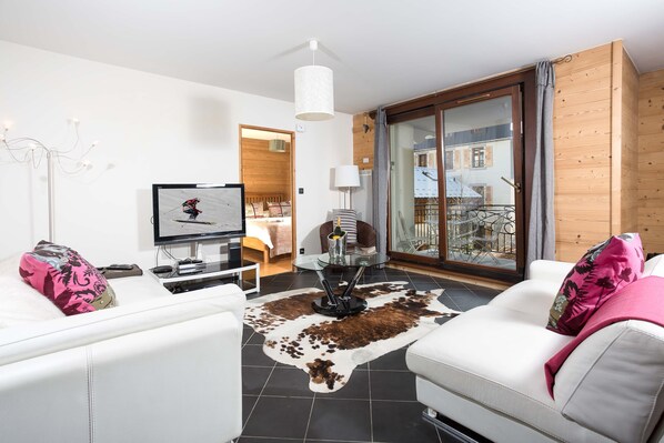 Spacious open plan lounge leading onto balcony