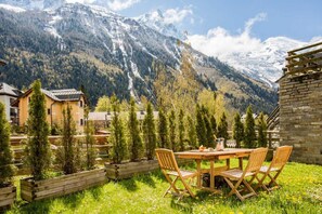 Garden with chairs and table in the spring