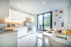 Modern and well-equipped kitchen opens onto balcony