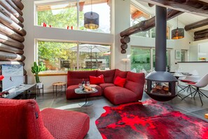 Open plan living dining room with large windows