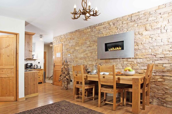 Luxury designed dining area with mural fireplace