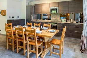 Dining and open kitchen area seats up to 8 people