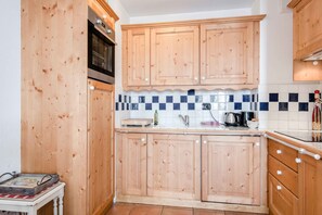 Well-equipped kitchen in open-plan living area