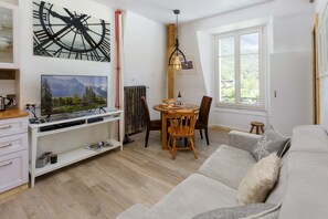 Lounge with flatscreen TV and dining area