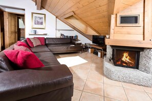 Lounge with leather sofa's and cosy log fire