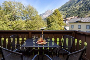 Balcony off the lounge with furniture and mountain views