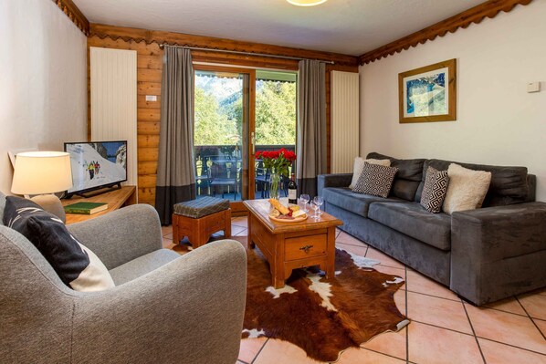Comfy lounge leading onto balcony