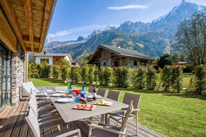 Step outside and enjoy the outdoor table with plenty of space for 10 people